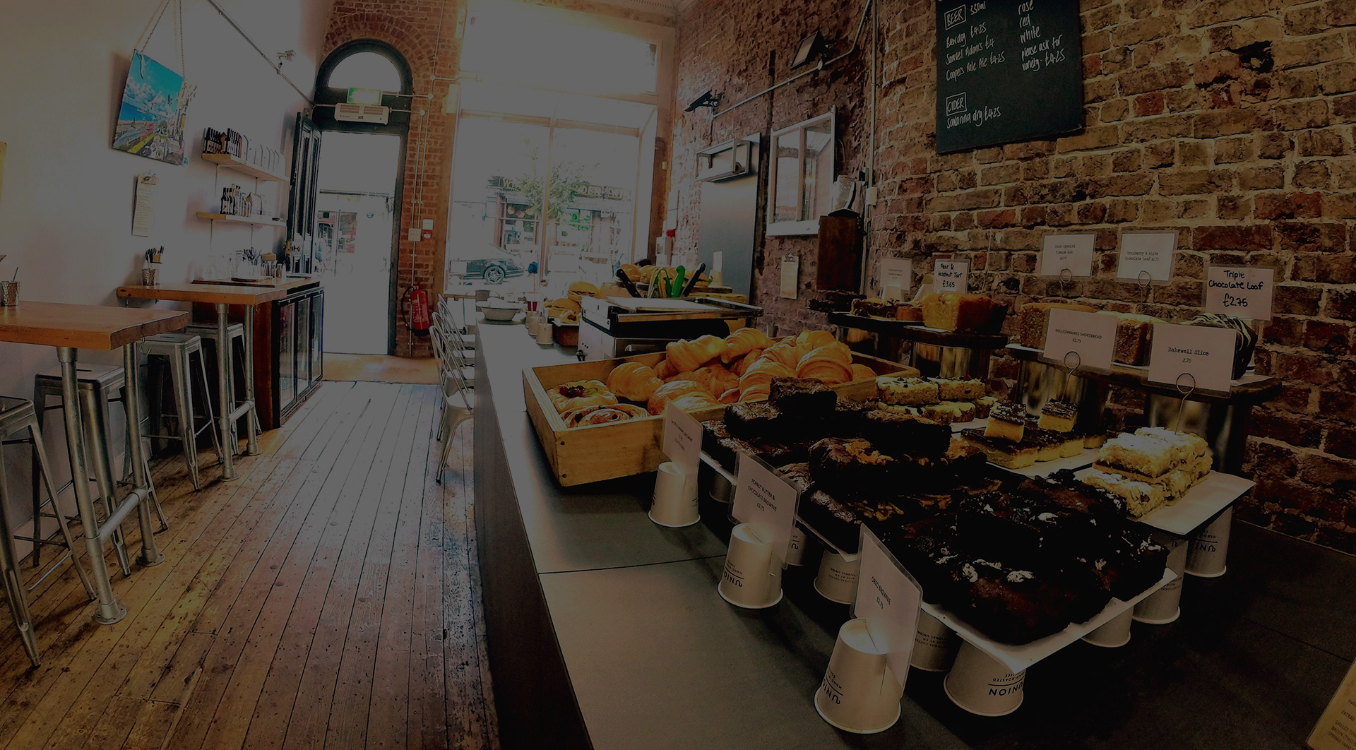 Cafe Coho Queens Road counter with cakes and pastries